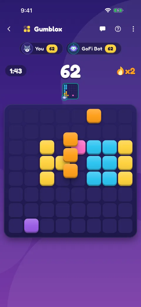 A Gumblox race against GoFi Bot, with a piece held over the board